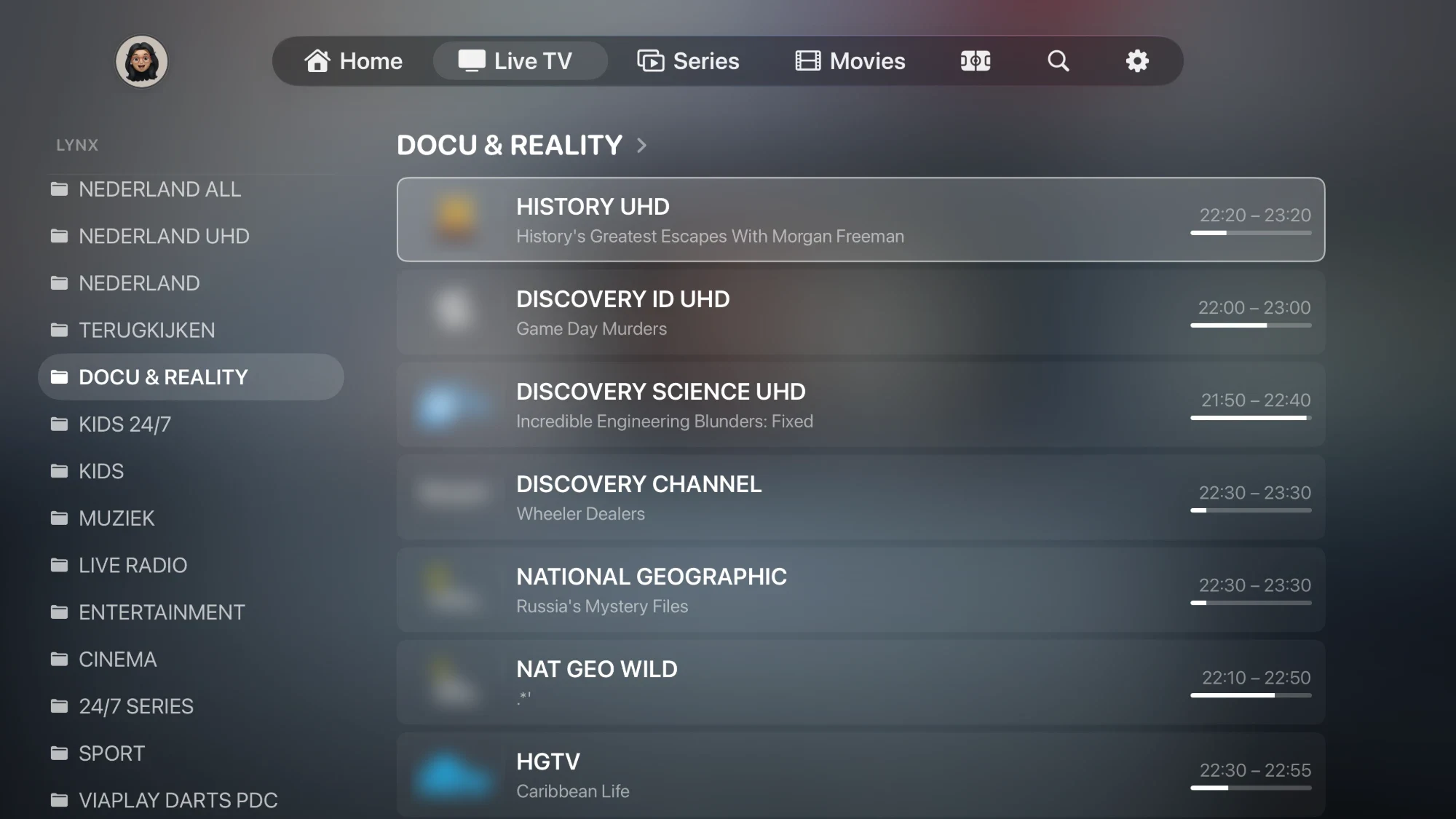 Live TV in NowSeen on Apple TV: category folders on the left, channels with what's on now and a progress bar on the right.